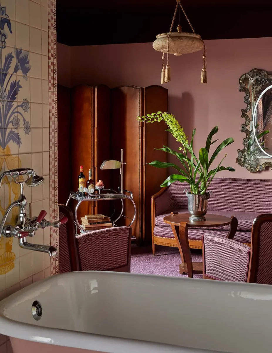 Sculptural foliage arranged in a richly layered rose-colored interior