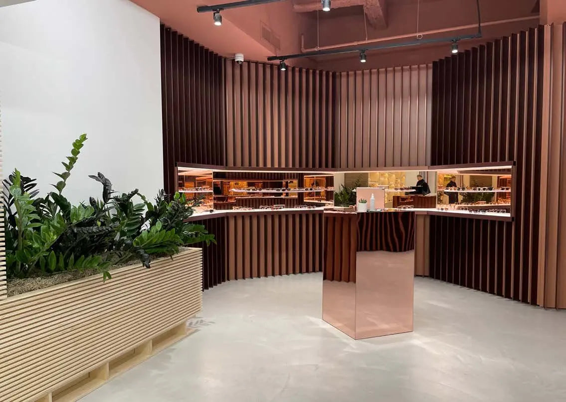 A timber cafe counter edged with a long planted trough